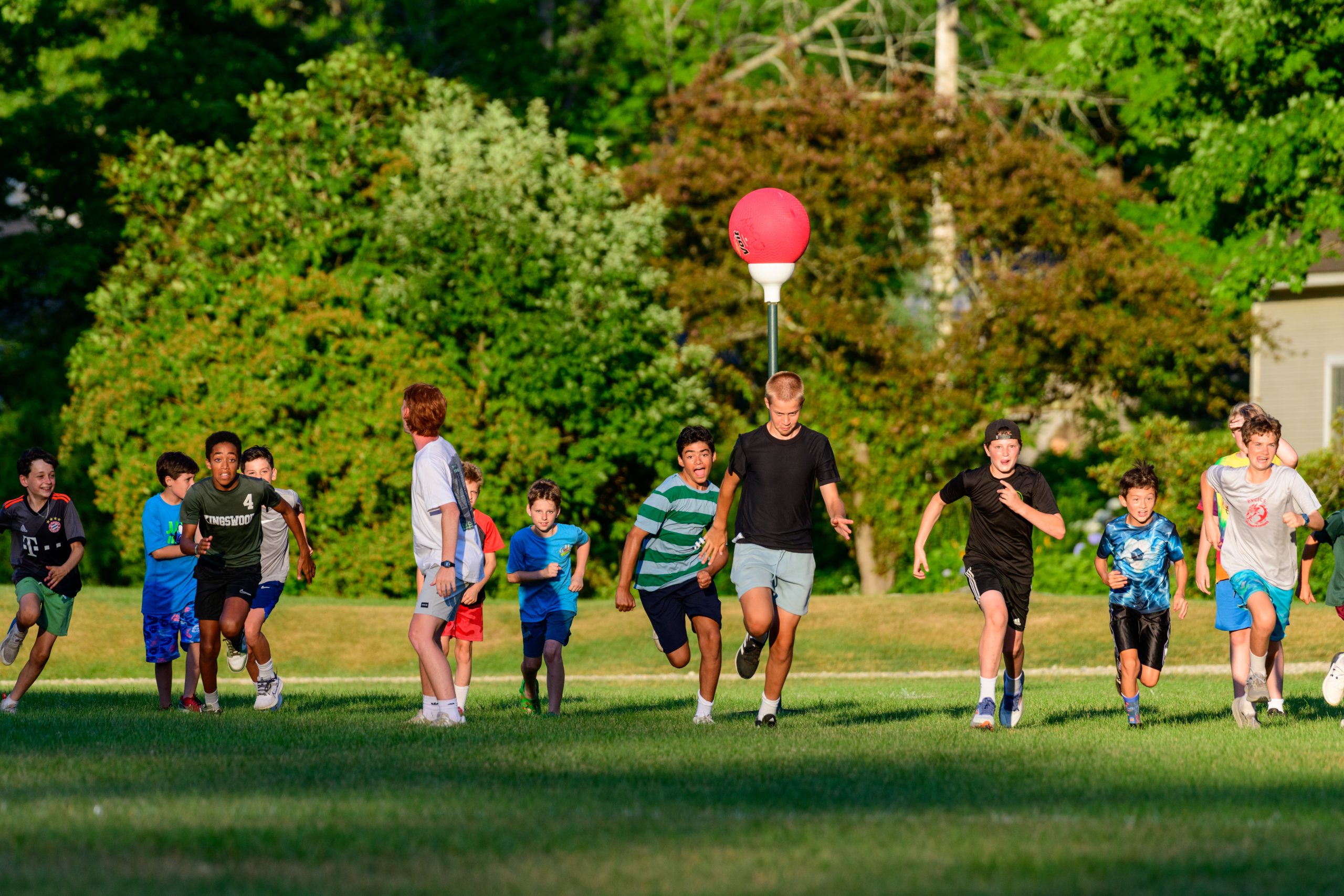 Campers running across a field