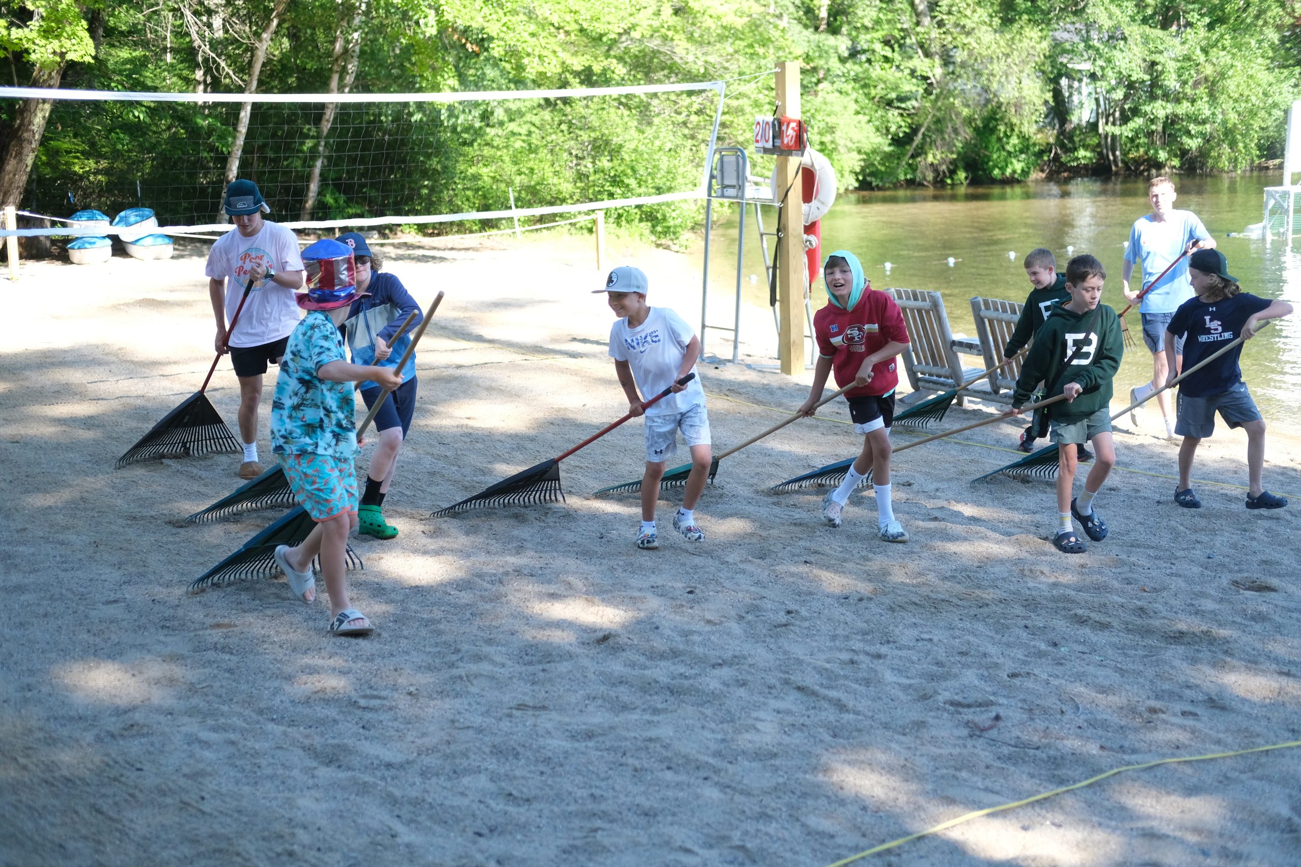 Campers raking the beach
